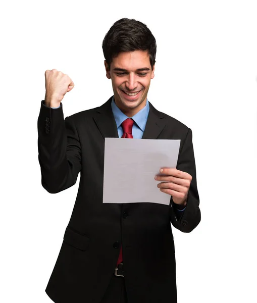 Happy businessman reading document — Stock Photo, Image