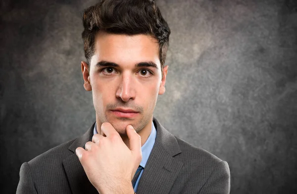 Young businessman thinking — Stock Photo, Image