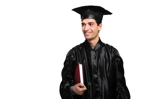Młody absolwent człowiek uśmiechający się — Zdjęcie stockowe
