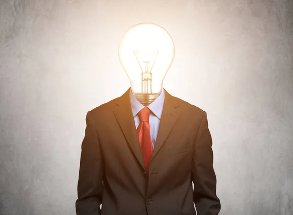 Man with light bulb instead of head — Stock Photo, Image