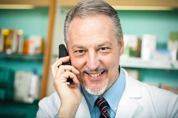 Pharmacist at work in his shop — Stock Photo, Image