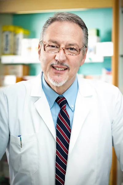 Pharmacist at work in his shop — Stock Photo, Image