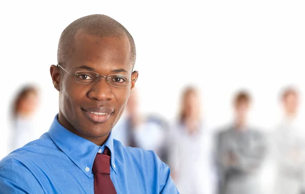 Black businessman in front of people — Stock Photo, Image