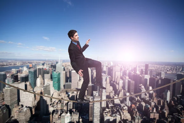 Businessman trying to mantain hte balance Stock Image