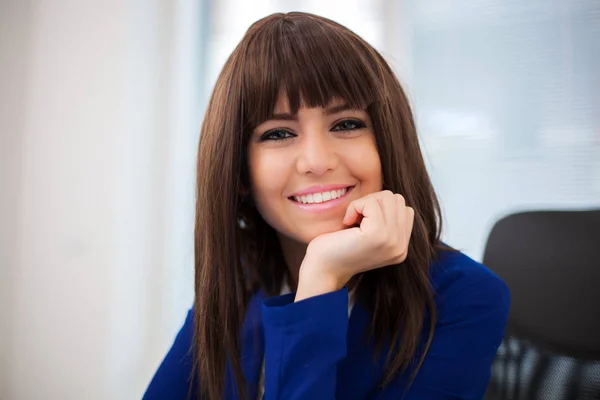 Businesswoman smiling in the office — Stock Photo, Image