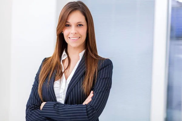 Beautiful businesswoman smiling in office Stock Picture