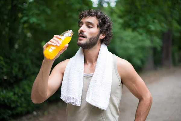 man drinking after sport