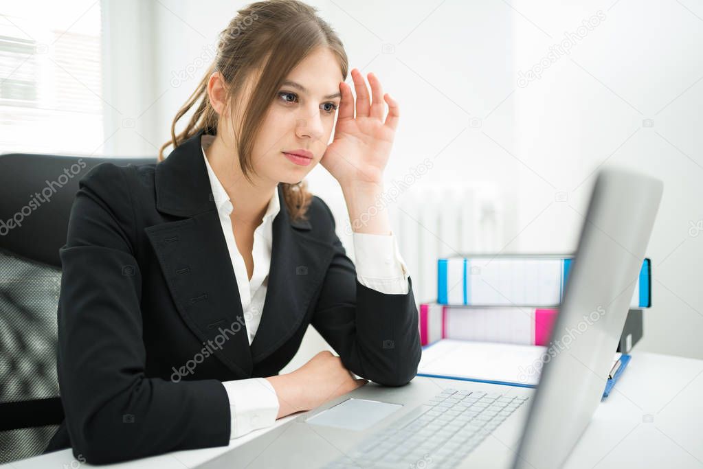 Woman looking at her computer monitor