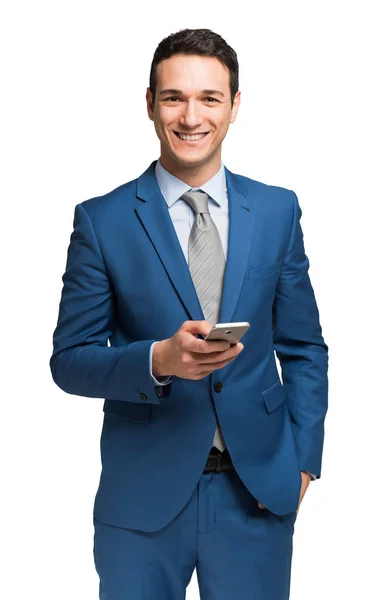Affärsman med en mobiltelefon — Stockfoto