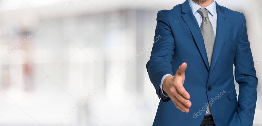 Businessman giving handshake