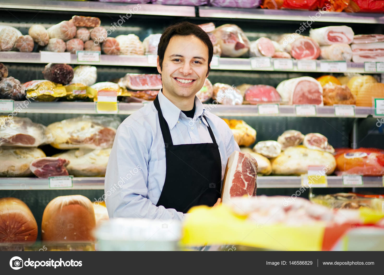 Butcher in grocery store — Stock Photo © minervastock 146586829