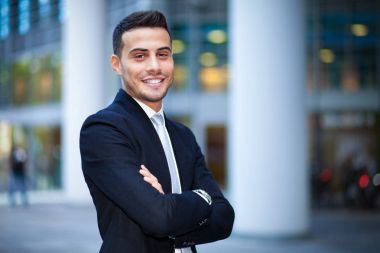 businessman smiling in urban setting  clipart