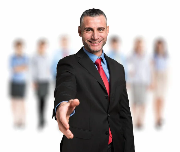 Businessman in front of business colleagues — Stock Photo, Image