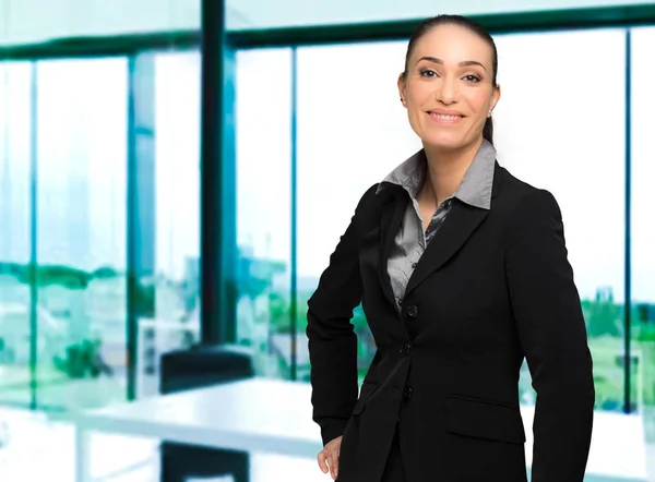 Businesswoman smiling in the office — Stock Photo, Image