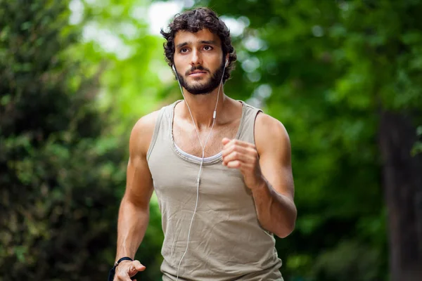 Man running in a park — Stock Photo, Image