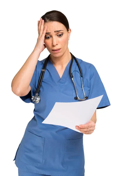 Shocked nurse reading document — Stock Photo, Image