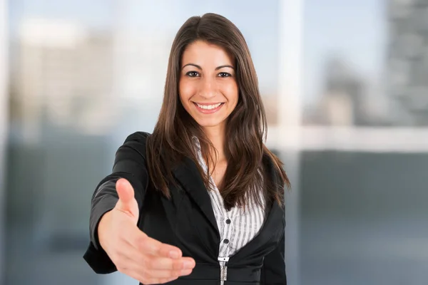 Businesswoman offering an handshake Stock Photo