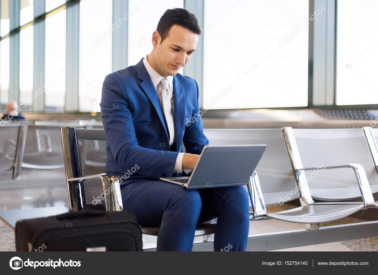 Businessman using laptop in airport — Stock Photo © minervastock 152754140