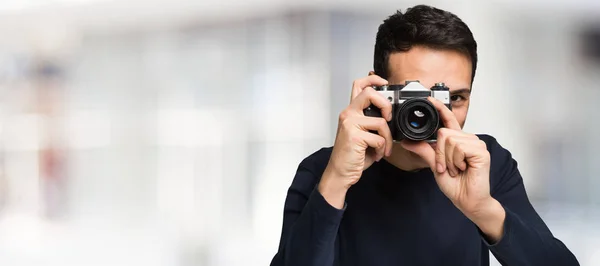 Handsome Photographer with camera — Stock Photo, Image