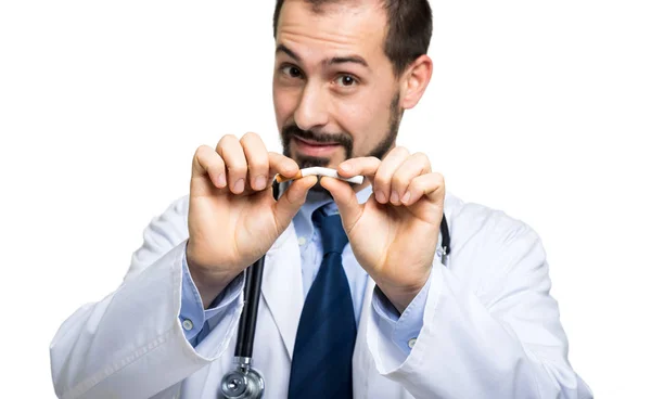 Handsome doctor breaking cigarette — Stock Photo, Image