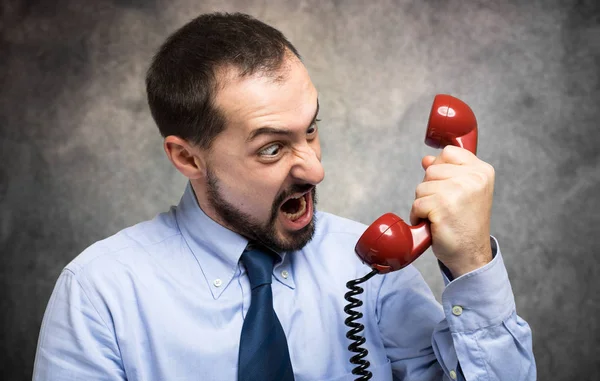 Businessman angry yelling in the phone — Stock Photo, Image