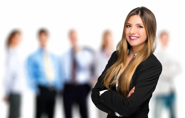 Businesswoman smiling with arms crossed — Stock Photo, Image