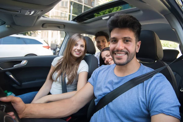 happy friends in the car