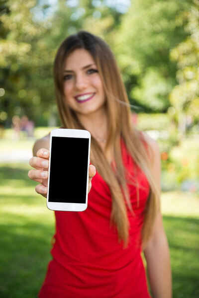 woman showing smartphone 