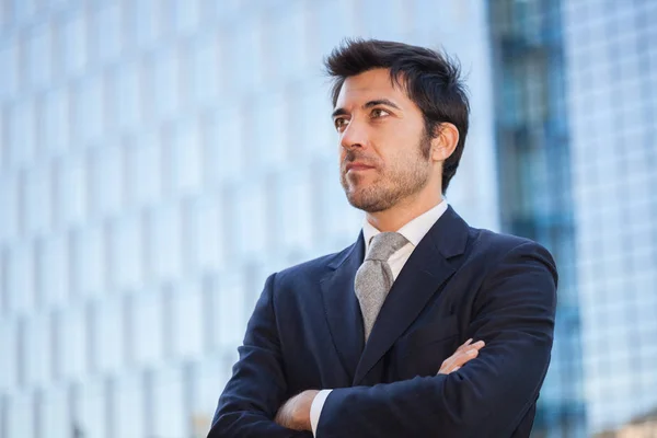 Handsome businessman with crossed arms — Stock Photo, Image