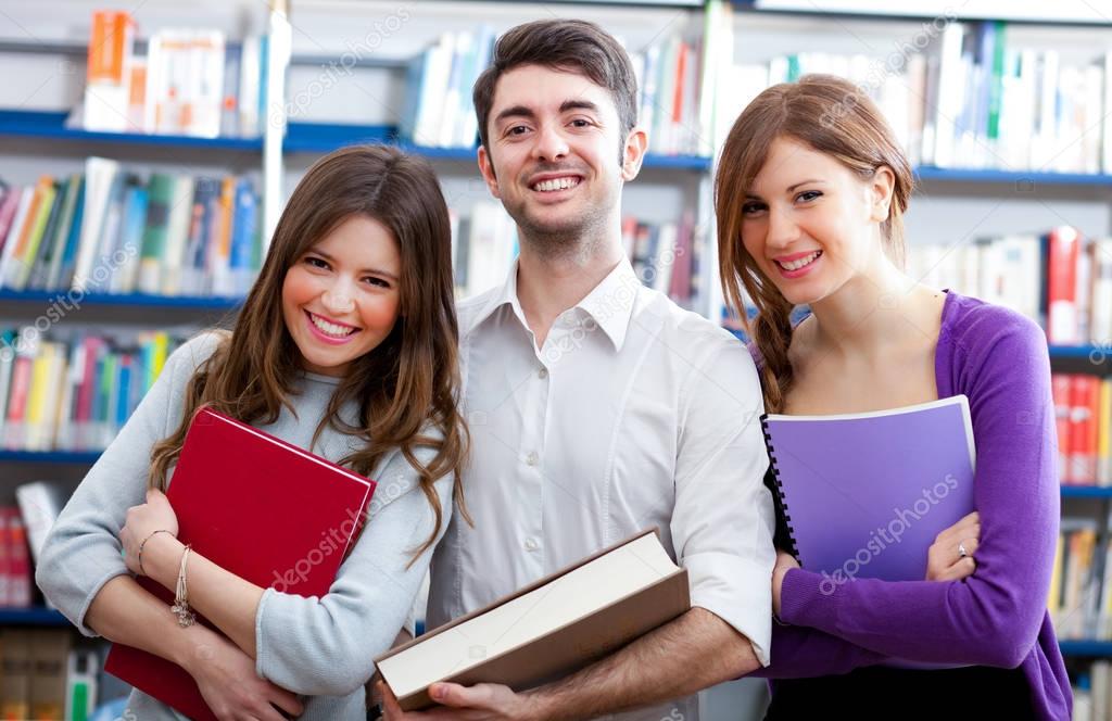 Students smiling in a Library 