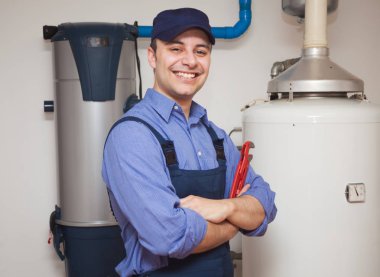 Plumber with wrench smiling  clipart