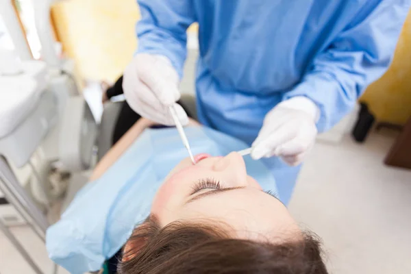 Senior dentist curing patient — Stock Photo, Image