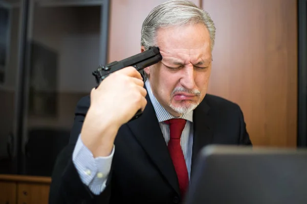 Senior businessman shooting himself — Stock Photo, Image