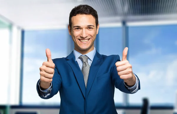 Businessman showing thumbs up — Stock Photo, Image