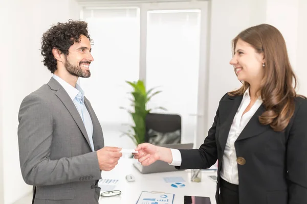People exchanging business cards