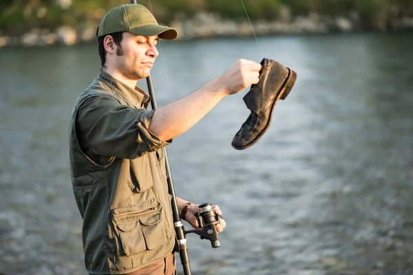 Fisherman Holding Old Shoe — Stock Photo, Image