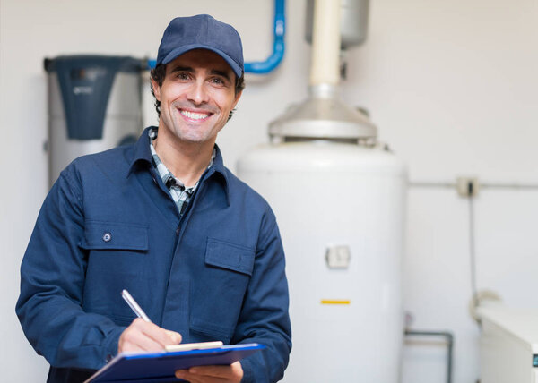 Technician servicing an hot-water heater