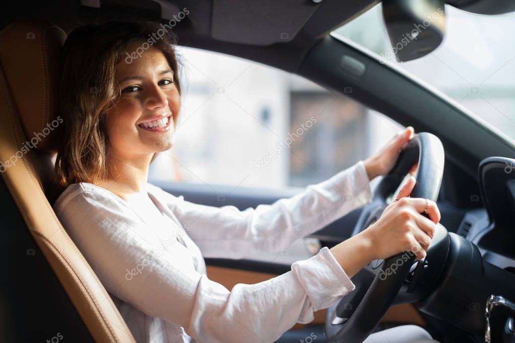 Young woman driving her car