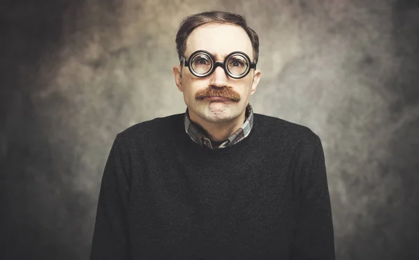 Funny portrait of a nerd man wearing nerd glasses