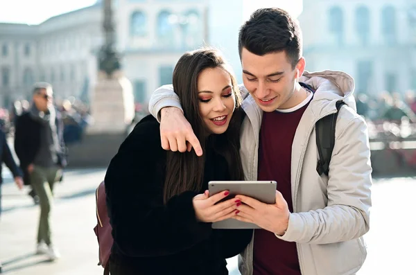 Young Couple Using Digital Tablet Outdoor While Visiting City — Stok fotoğraf