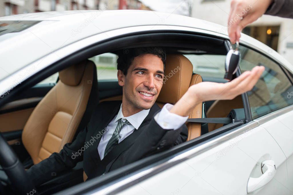 Man taking his car keys after servicing