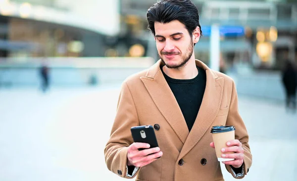 Handsome Elegant Dressed Man Using His Smartphone Holding Cup Coffee — Stock Photo, Image