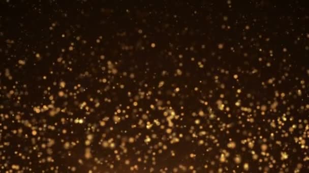 Goldpartikel. natürliche schwebende organische Teilchen auf schönem Hintergrund. Glitzerpartikel mit Bokeh. Zeitlupe. — Stockvideo