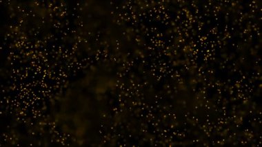 Altın parçacıkları. Doğal yüzen organik parçacıklar üzerinde güzel arka plan. Işıltılı parçacıklar Bokeh ile. Ağır çekim.