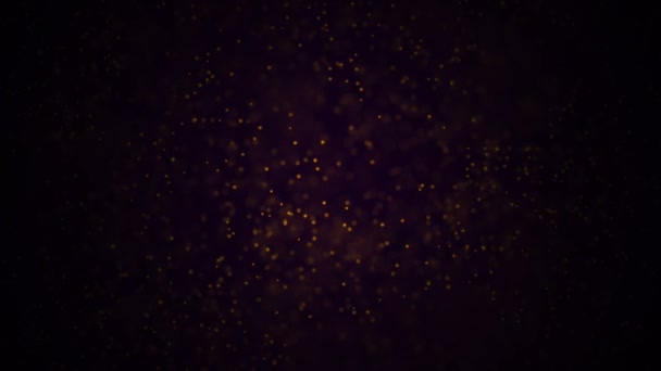 Goldpartikel. natürliche schwimmende organische Teilchen auf herrlich entspanntem Hintergrund. Glitzerpartikel mit Bokeh. Zeitlupe. — Stockvideo