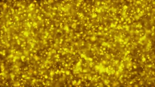 Cząsteczki złota. Naturalne pływające organiczne cząstki na piękny relaks tło. Błyszczących cząstek z Bokeh. Zwolnionym tempie. — Wideo stockowe