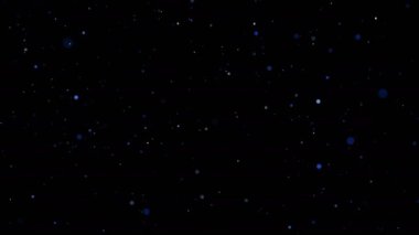 Titreşme parçacıkları, parçacıkların rastgele hareketi. Güzel rahatlatıcı arka plan üzerinde. Volumetrik ışıkta bokeh Ile ışıltılı parçacıklar