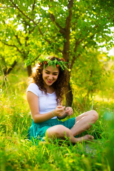 Young girl in green garden in the morning — Stock Photo, Image