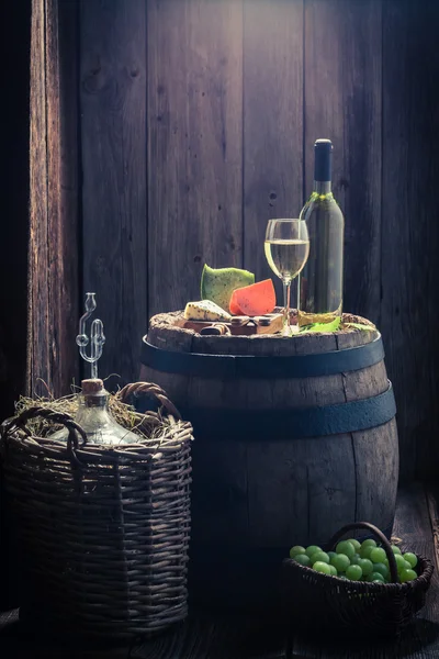 White wine and mix of cheese, grapes and demijohn with copy space — Stock Photo, Image