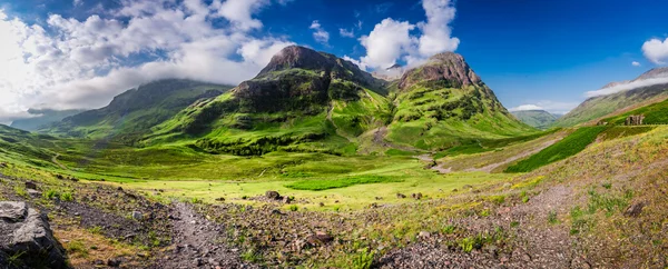 Dechberoucí panorama hor v Glencoe za úsvitu, Skotsko — Stock fotografie